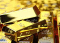 Gold hovers close to document excessive on greenback weak spot, rate-cut bets