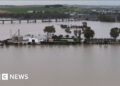 Aerial footage reveals flooded cities as storms hit Spain
