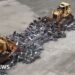 A whole lot of unlawful motorbikes bulldozed in NYC crime crackdown