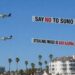 Keep in mind ‘Say No To Suno’? Somebody simply employed a aircraft to fly it over an AI investor summit… that includes Mikey Shulman.