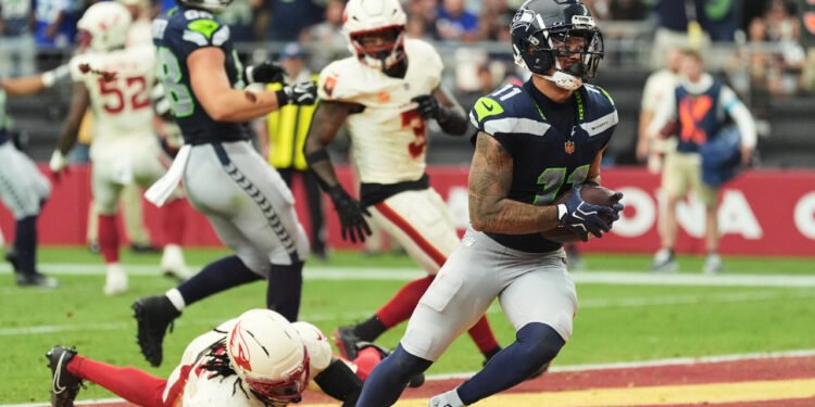 Lock connects for 3 TDs with Smith-Njigba, Seahawks roll previous Cardinals